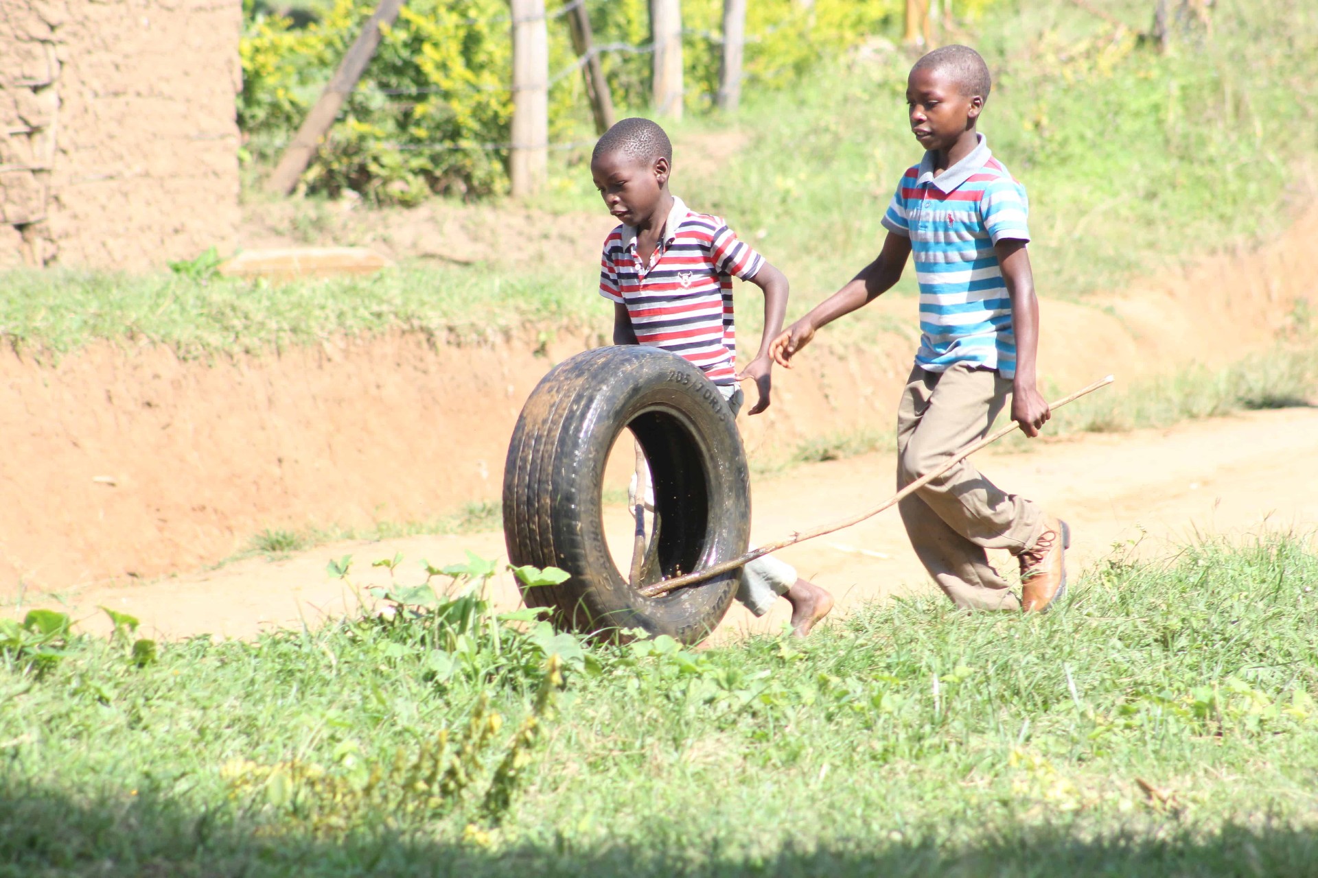 Children playing with a tire